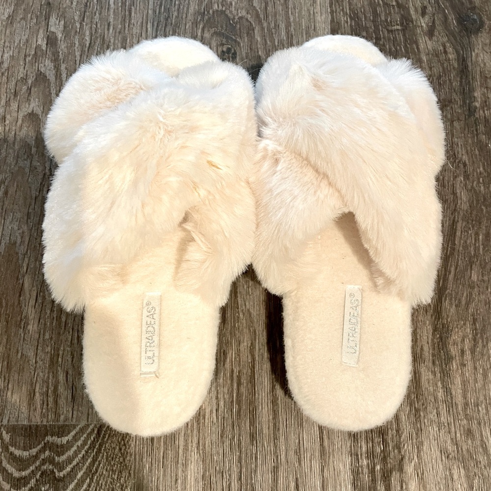 Brand new warm cozy house slippers. Never worn.